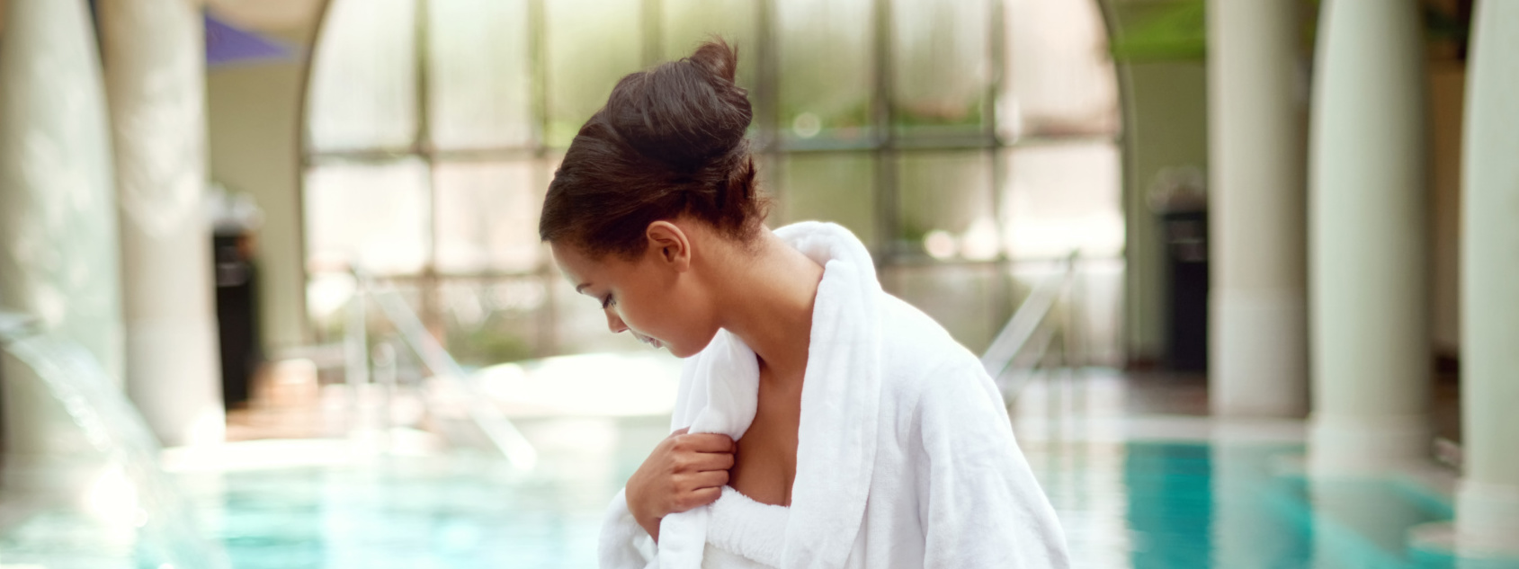 Shot of an attractive young woman about to go for a relaxing swim at a spa.
